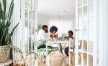 young family of three eat together at the breakfast table